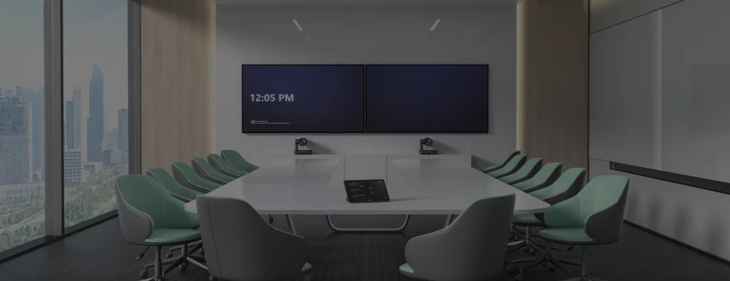 Modern conference room with a long table, dual displays on the wall, and a Yealink CP925 phone placed at the center.