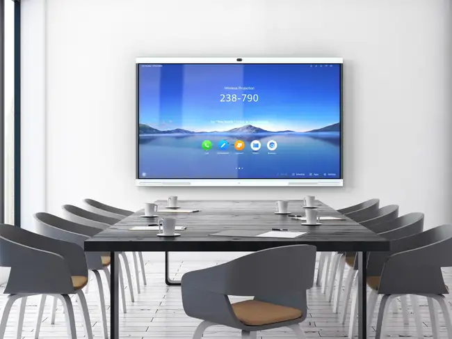 Business professionals using Huawei IdeaHub for a virtual meeting with interactive whiteboard and video conferencing features