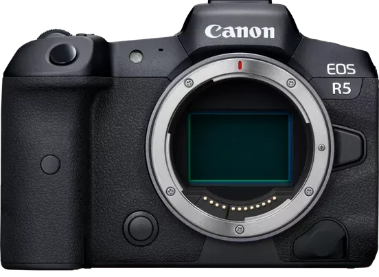 A front-on product shot of a black Canon EOS R5 mirrorless camera body against a gray background. The camera's lens mount is prominent, with the green image sensor visible inside.