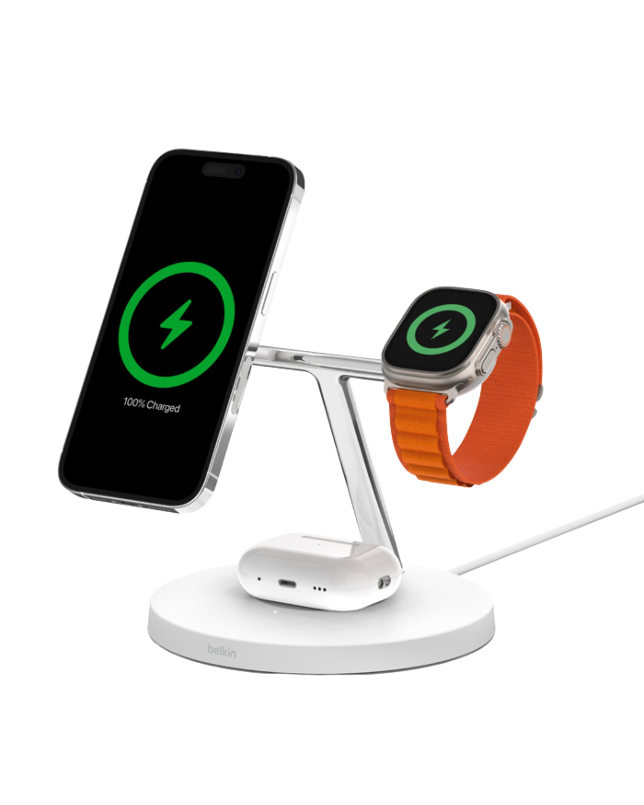 Belkin BoostCharge Pro 3-in-1 Wireless Charging Stand with MagSafe featuring an iPhone, Apple Watch Ultra with an orange strap, and AirPods charging simultaneously on a white base.