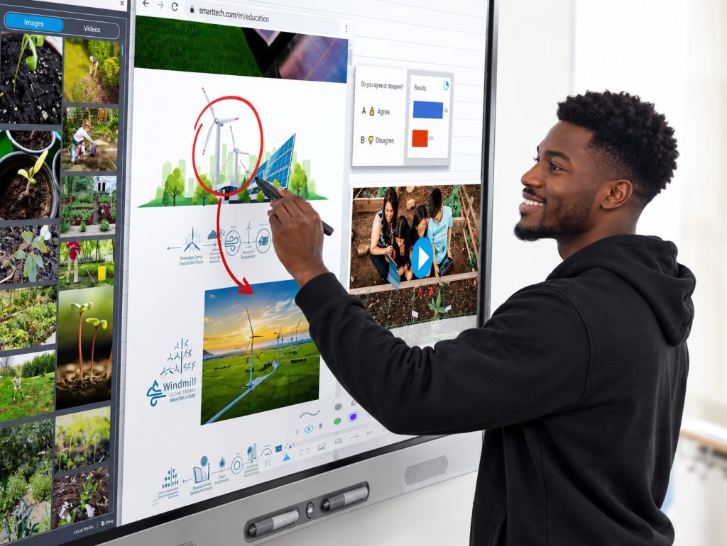 A smiling man using a stylus to write and interact with an interactive smart display board showing an educational lesson on renewable energy.